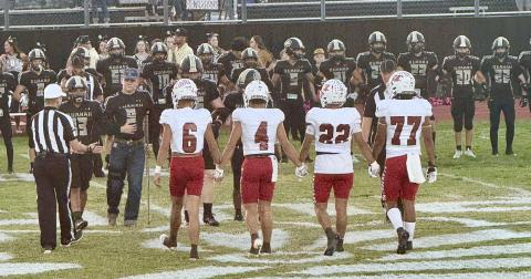Wellington’s Major Brown (6), Noah Cantu (4), Gustavo Soto (22) and Yobani Moreno (77) prepare to take on the Quanah Indians Friday, Oct. 17 in Quanah, where the Skyrockets took a 50-13 victory to remain undefeated in district play. Courtesy Photo