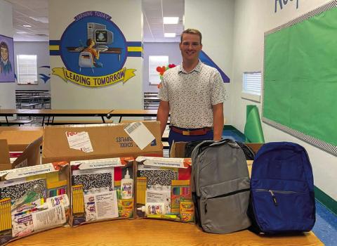 Childress Elementary School accepts a school supply donation from Silas Ragsdale – State Farm Insurance Office Manager Travis Brooks. “Thank you to Travis Brooks from State Farm Insurance for bringing some school supplies for our students,” Childress Elementary School Principal Tracey Blake said. Photo Courtesy of Childress Elementary School