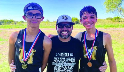 Following a 10th-place finish at the recent Jeep Webb Memorial Run, Memphis’ Ryder Robison medals at the Valley Invitational Tuesday, Sept. 6 at Caprock Canyon, finishing first in the varsity division, followed by Kyler Robison, who finished fifth in the junior high division, and Nathan Perkins, who finished eighth in the junior high division. From left, R. Robison, father John Robison and K. Robison. Photo Courtesy of Memphis ISD