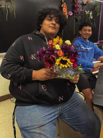 Floral design students upcycle tin cans