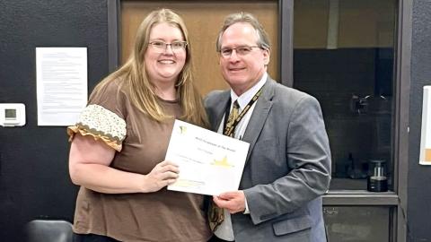 Memphis Independent School District (ISD) Superintendent William Alexander congratulates March Employee of the Month Ami Tribble, who teaches first and second-grade mathematics at Austin Elementary School. Memphis ISD
