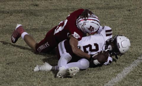 Skyrocket Nixon Folk (13) tackles Clarendon’s quarterback, Lyric Smith (2), in the district championship game last Friday, as Wellington fell 36-20, finishing as the No. 2 seed in the district. The Red River Sun/Shauna Salinas