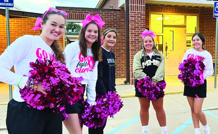 Cyclone cheerleaders greet Travis Elementary students