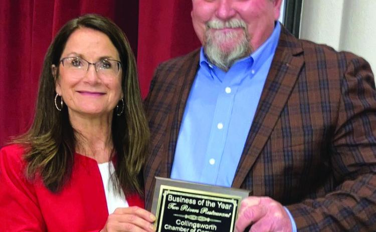 Two Rivers Family Restaurant owner Clint Thomas, right, receives the Collingsworth County Chamber of Commerce Business of the Year from Karen Caldwell. Photos by Neal Odom