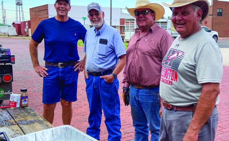 Paul Dockter, left, Oran Sain, Don Allred and Keith Martin share their skills, grilling hamburgers and hotdogs for Wellington Senior Citizens Center’s monthly social at 6 p.m. Thursday, July 13. Courtesy Photos