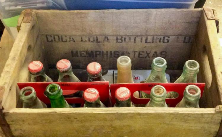 A wooden crate, from the Memphis Coca-Cola Bottling Company, which reads, “Coca-Cola Bottling Co., Memphis, Texas.” Photos Courtesy of the Collection of John R. Ballew