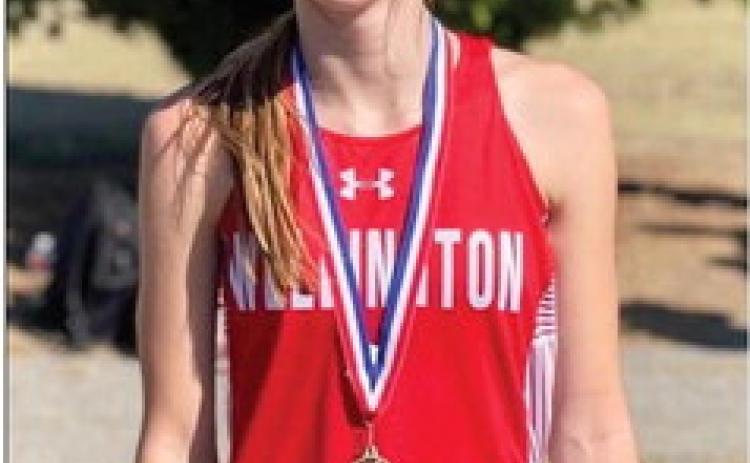Freshman Lady Rocket Charlee Bodine claims the ninthplace medal in the junior varsity girls division at the district cross country meet in Shamrock last week. Courtesy Photo