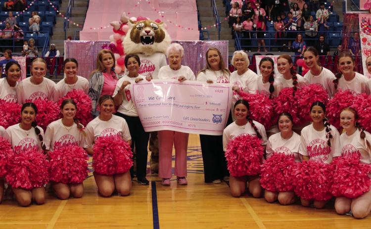 We Can Care’s Kimberly Hickman, Sarah Haseloff, Carolyn Jennings, MeLisa Lugo and Barbara Sue Parr accept a donation in the amount of $3,484 from Childress High School cheerleaders at the annual Pink Out Pep Rally Friday, Oct. 7. Funds were raised through the sale of pink out T-shirts. We Can Care, a local nonprofit organization, aids Childress County cancer patients through the furnishing of gas cards. Photo by Childress High School Yearbook Staff
